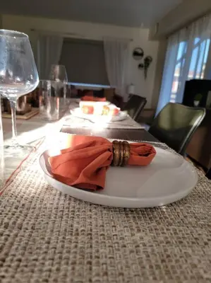 a white plate with a napkin on a table at San Diego Oasis with Hot Tub, Gym, Outdoor Theater, Huge Yard in San Diego