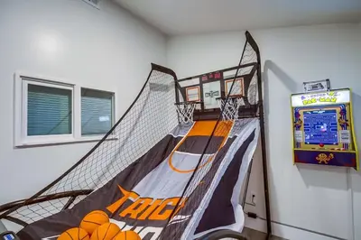an indoor basketball court with a net in a room at Lux Escape 2 • Views Hot Tub Games Mini Golf in San Diego