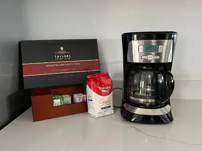 a coffee maker and a box on a counter at Lux Escape 2 • Views Hot Tub Games Mini Golf in San Diego