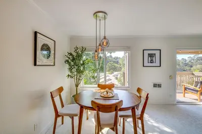 a dining room with a table and chairs at San Diego Condo with Pool Access about 2 Mi to Beach! in San Diego