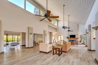 an open living room with a ceiling fan at San Diego Condo with Pool Access about 2 Mi to Beach! in San Diego