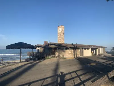 a building with a clock tower on the beach at San Clemente Beach home walk to beach and downtown in San Clemente