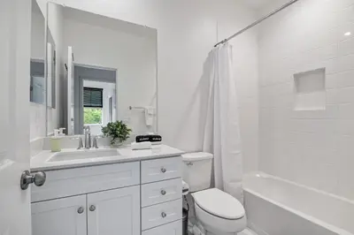 a white bathroom with a sink and a toilet at Better Two-Gether 2-bed 2,5-bath in Oceanside