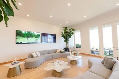 a living room with two couches and two tables at La Jolla Ocean View Mansion 2 in San Diego