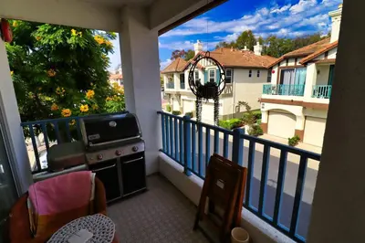 a balcony with a stove and a view of a building at Sweet Pea Place, 2 bed with pool in Encinitas