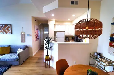 a living room with a couch and a table at Sweet Pea Place, 2 bed with pool in Encinitas