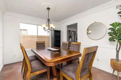 a dining room with a wooden table and chairs at Sunset Views Retreat in Vista