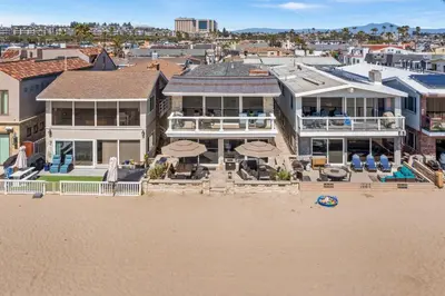 an aerial view of a house on the beach at Oceanfront 3BR Home with Pool Table & Patio in Newport Beach