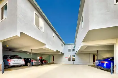 a parking lot with cars parked in a building at Oceanfront Condo in Newport Beach with Private Balcony and Perfect Location by the Pier in Newport Beach