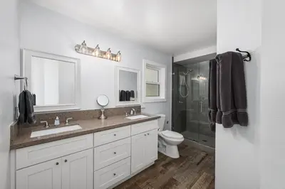 a white bathroom with a sink and a toilet at Stunning Casa Surf House in Newport with Parking Stunning Casa Surf House in Newport in Newport Beach