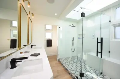 a bathroom with a shower and a sink at 4BR Luxury Del Mar Beach House with Ocean Views in San Diego