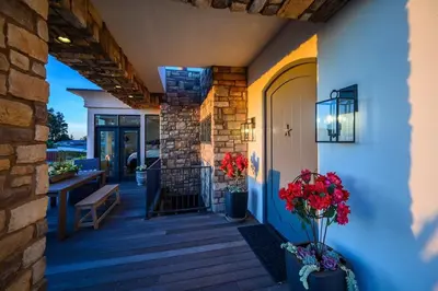 a porch of a house with flowers on it at 4BR Luxury Del Mar Beach House with Ocean Views in San Diego
