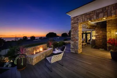 a deck with a fire pit and a patio at 4BR Luxury Del Mar Beach House with Ocean Views in San Diego
