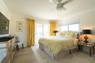 a bedroom with a bed and a large window at Designer Family Home with Resort-Style Oasis in San Diego
