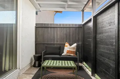 a small patio with a couch and a table at Pacific Beach Studio Short Walk to Ocean in San Diego