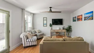 a living room with a couch and two chairs at 6 Bedroom Family Getaway Walk to Law Street Beach in San Diego