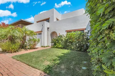 an image of a house at Pacific Views Retreat - Rooftop Deck, Game Room, Fire Pit & Cozy Backyard! in San Diego