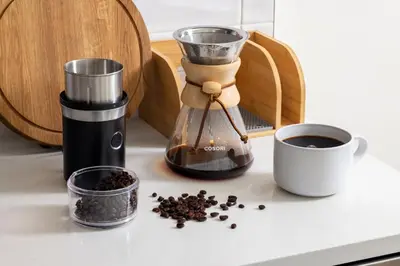 a coffee maker and a cup of coffee on a counter at Kasa Little Italy San Diego in San Diego
