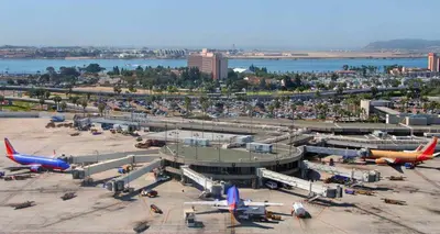 an airport with airplanes parked at the terminal at Studio 6 San Diego, CA Hotel Circle Mission Valley in San Diego