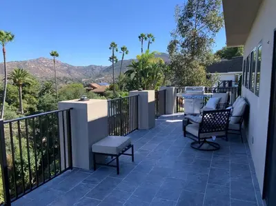 a patio with chairs and a grill on a house at New Constructed Home in Poway in Poway