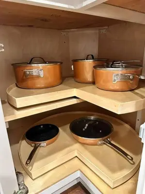 four pots and pans on a shelf in a kitchen at Anselmo in Mission Viejo