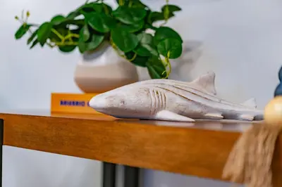 a statue of a shark on a table with a vase at Gorgeous Villa Steps to La Jolla Cove in San Diego