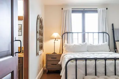 a bedroom with a bed and a window at Spanish Dream with Ocean Views in Encinitas