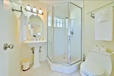 a bathroom with a shower and a toilet and a sink at Beach Happy in San Diego