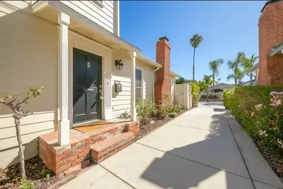 a front door of a house with a sidewalk at Beach Happy in San Diego