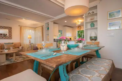 a dining room with a wooden table and chairs at Las Palmas Escape in San Diego