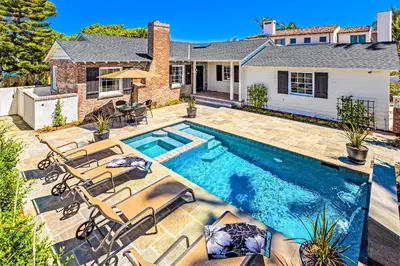 a swimming pool in the backyard of a home at Las Palmas Escape in San Diego