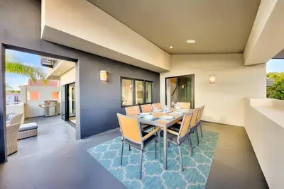 a dining room with a table and chairs at Sunny Shores in San Diego