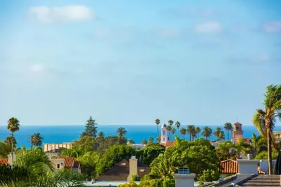a view of a city with palm trees and the ocean at Sunny Shores in San Diego