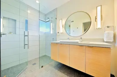 a bathroom with a sink and a mirror at Sunny Shores in San Diego