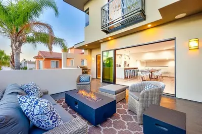 a living room with a couch and chairs at Sunny Shores in San Diego