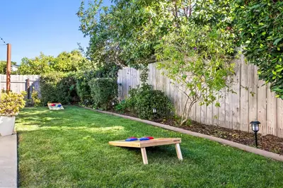 a picnic table in the grass in a backyard at Family Oasis with Hot Tub and Dedicated Workspace in San Diego