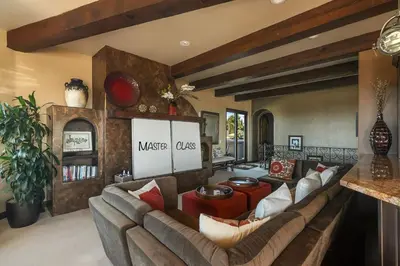 a living room with a couch and a table at Timeless Spanish Villa with Panoramic Ocean Views in San Diego
