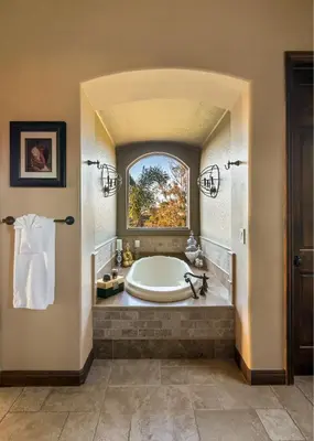 a large bathroom with a tub and a window at Timeless Spanish Villa with Panoramic Ocean Views in San Diego
