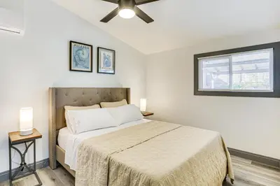 a bedroom with a large bed and a window at Mission Valley Home 5 Mi to SDSU Campus in San Diego