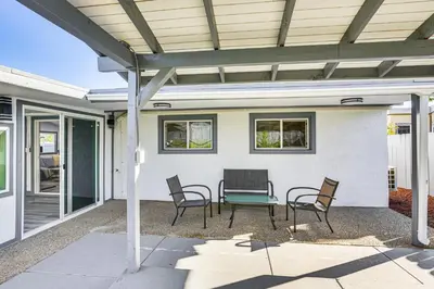 a patio with chairs and a table and awning at Mission Valley Home 5 Mi to SDSU Campus in San Diego