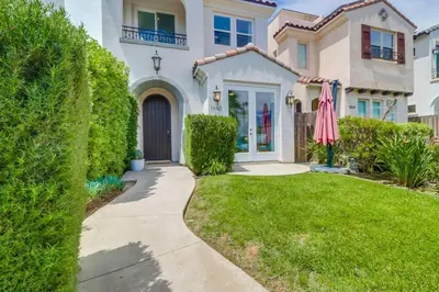 a house with a walkway in front of a yard at Rooftop Patio Hot Tub AC Beach & Bay Views in San Diego