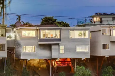 a large house with many windows on a street at Ventana Vista, Ocean View in San Diego