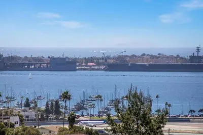 a large ship is docked in a large body of water at Ventana Vista, Ocean View in San Diego