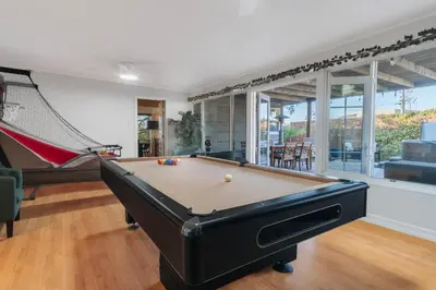 a pool table in a room with at Family-Friendly Bay Views, Game Room, Hot Tub! in San Diego