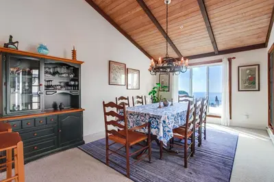 a dining room with a table and chairs at Ocean Views Moonlight Beach Ocean Deck Pool Hot Tub in Encinitas