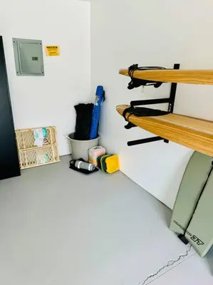 a room with a bench and tools on a wall at Beacons Beach Cottage in Encinitas