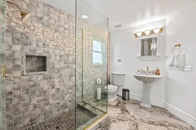 a bathroom with a shower and a toilet and a sink at Above the Clouds 17acre Gated Hilltop Estate in Fallbrook