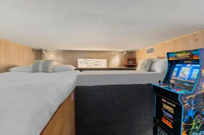 a room with two beds and a video game at Above the Clouds 17acre Gated Hilltop Estate in Fallbrook
