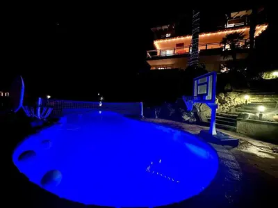 a large blue object is lit up at night at Above the Clouds 17acre Gated Hilltop Estate in Fallbrook