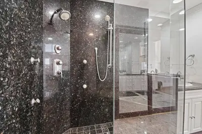 a bathroom with a shower with a glass door at Above the Clouds 17acre Gated Hilltop Estate in Fallbrook